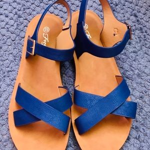 Blue Criss cross strap sandals size 7.5